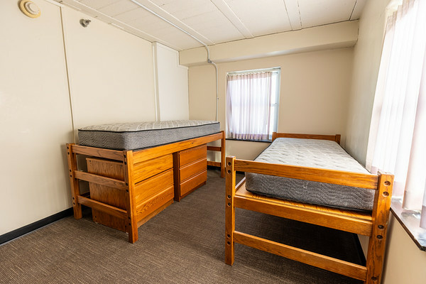 two beds shown in an empty Parklawn 1-bedroom apartment