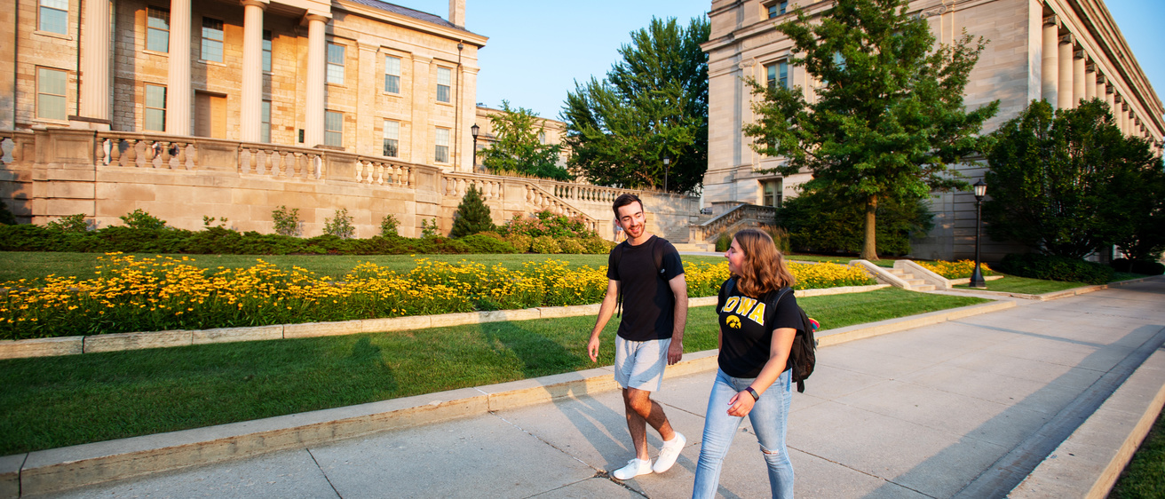 Students walking down a sidewalk near the old capitol