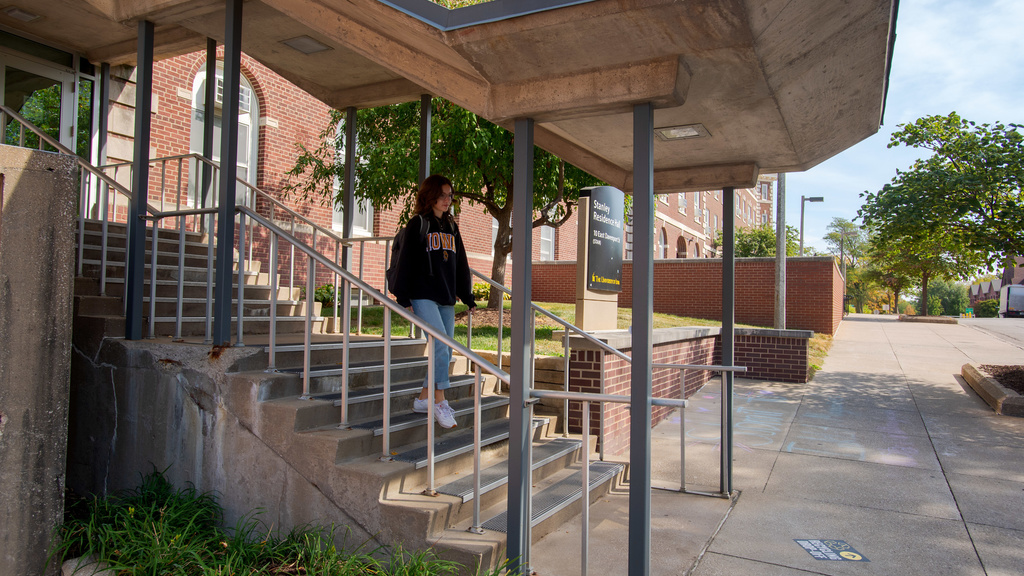 Student walking down a flight of stairs