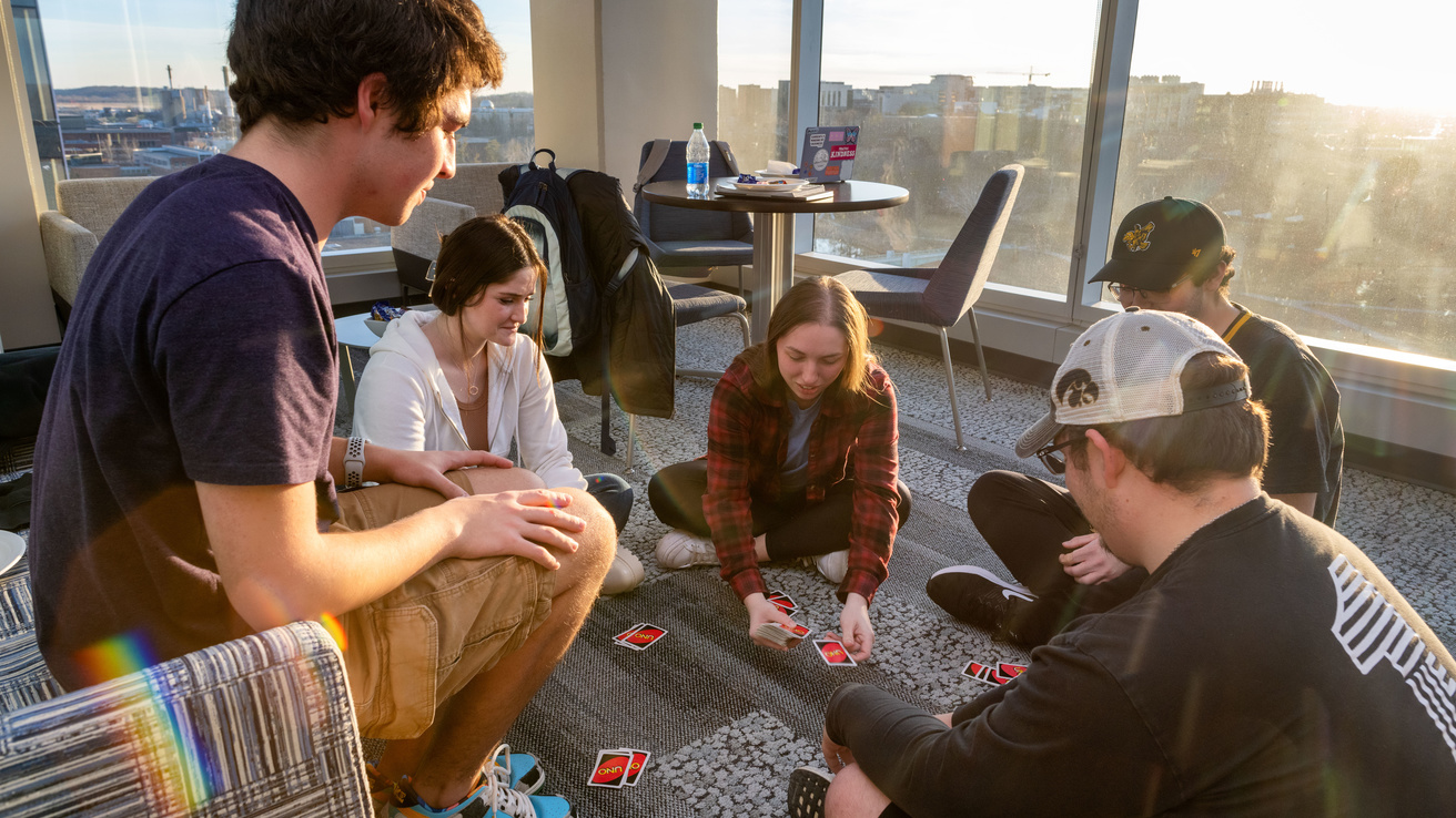 Students playing uno card game